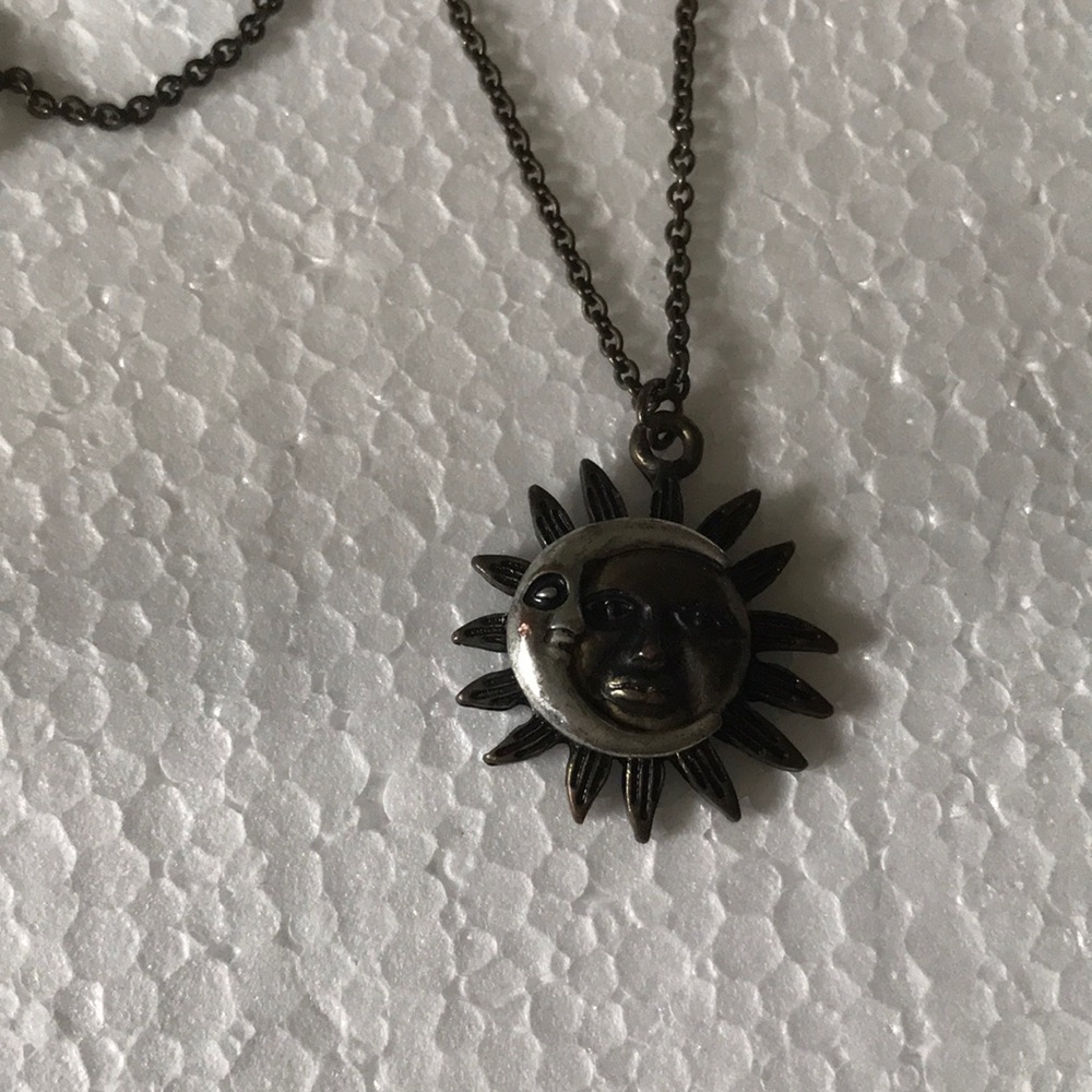 Claire’s face sun moon necklace